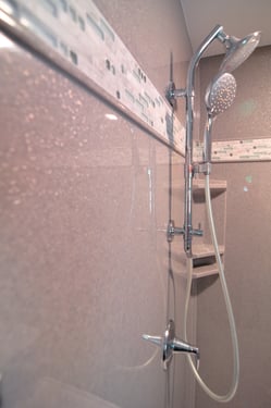 Solid surface shower walls have no grout to maintain or clean