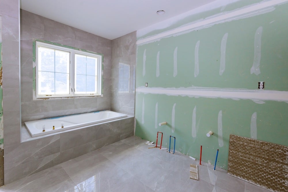 Under-construction-new-bathtub-remodeling-a-home-bathroom-plumbing-pipe-system-for-new-sinks